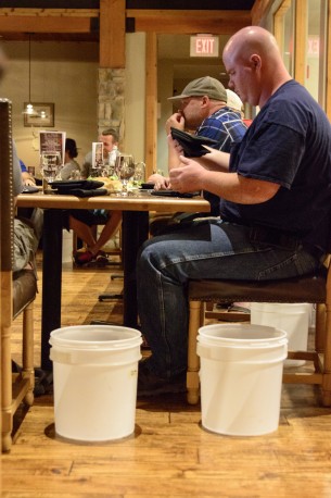 It's about to begin. The buckets have been placed just in case anyone can't keep their meal down. If they did vomit, the challenger would be disqualified.