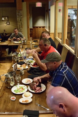 Center stage, Joe LaRue, attacks his 72 oz. steak.