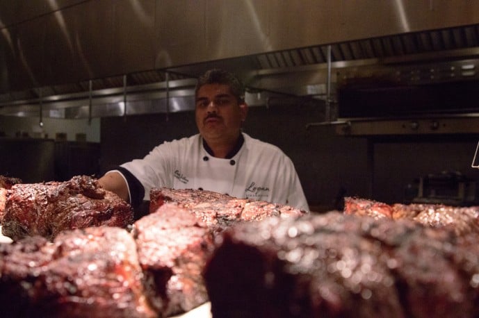 The Executive Chef takes one last look over the steaks and provides additional direction on who's steak is who's.