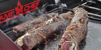 Stuffed venison backstrap on a grill