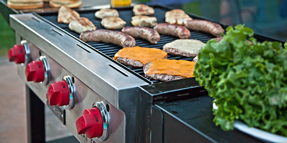 Grilled Burgers and Hot Dogs on a Flat Top Grill