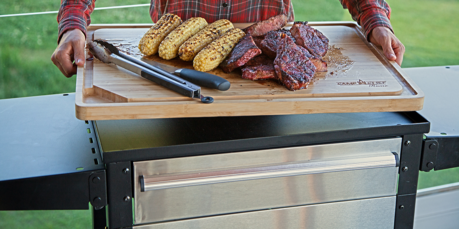 Bamboo Cutting Board Fitting on Top of Patio Cart with Steak and Corn