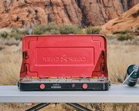 kodiak sitting on a camp table