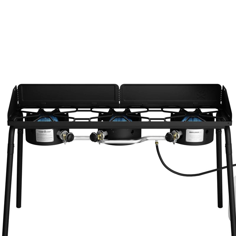 Load image into Gallery viewer, The Camp Chef Explorer is a double-burner outdoor gas stove with a sturdy metal frame, gas hose, side wind guards, and four legs—ideal for outdoor cooking adventures.
