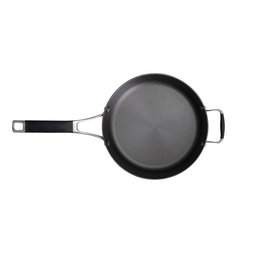 The Camp Chef Heritage Skillets is a black nonstick frying pan with excellent heat retention, a long handle on the left, and a small helper handle on the right, shown from above on a white background.