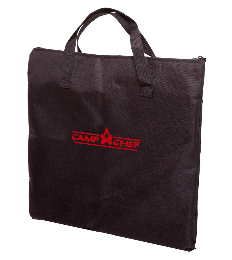 Load image into Gallery viewer, The Camp Chef Multipurpose Carry Bag is black with handles and a zipper, designed to fit fry griddles or a grill box, featuring the red Camp Chef logo and flame graphic on the front.
