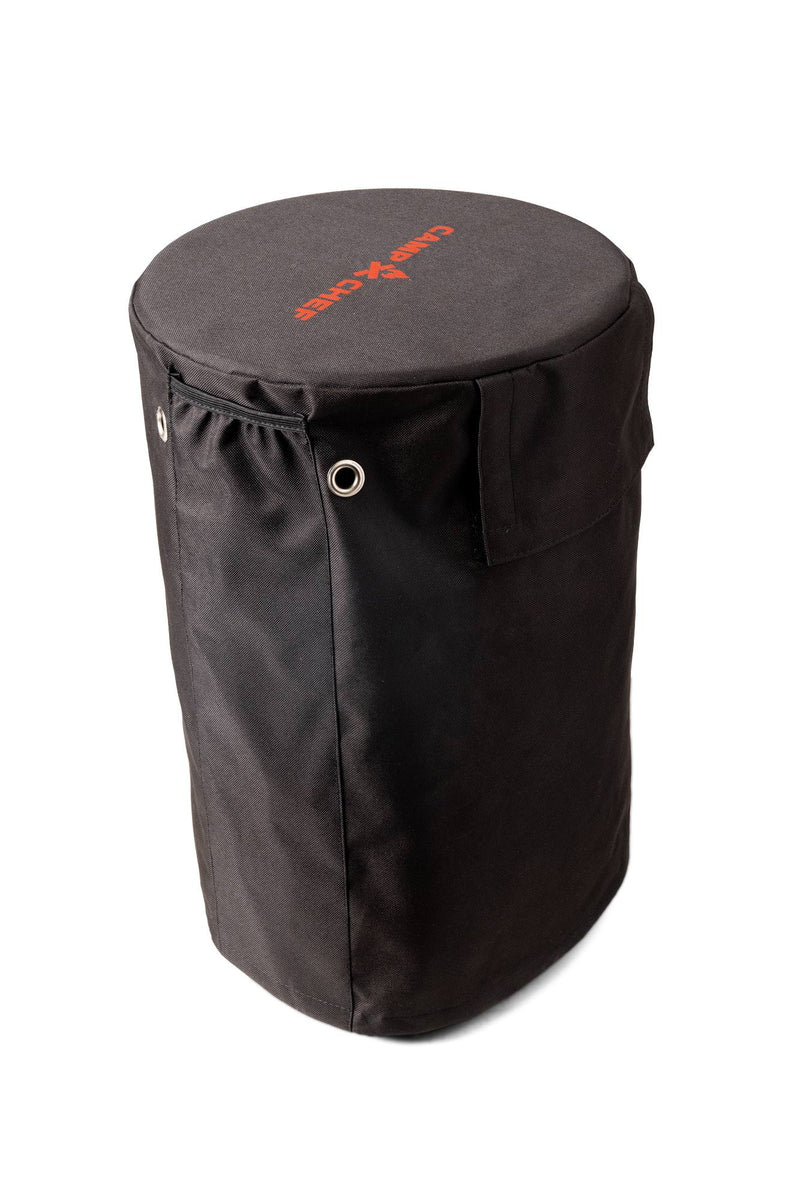 Load image into Gallery viewer, The Camp Chef Propane Tank Cover is a black cylindrical fabric bag with metal grommets, flap pocket, and red logo on top—a perfect camping accessory or tank cover, shown on a white background.
