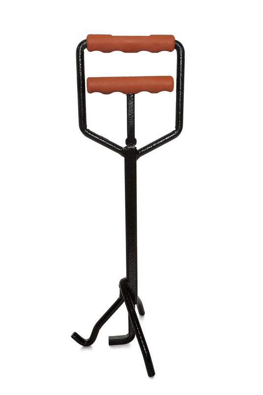 The Camp Chef Dutch Oven Lid Lifter is a black metal carrier tool with two orange handles and three legs—designed for lifting and transporting firewood or safely lifting Dutch oven lids, making it perfect for campfire cooking.