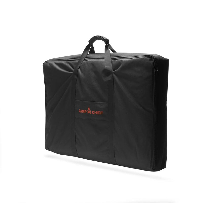 Load image into Gallery viewer, The Camp Chef Griddle Bag FTG600P is a black rectangular carry bag with two handles, zippered closure, and a front pocket featuring the Camp Chef logo in red—designed for convenient transport of your Portable Flat Top Grill 600 griddle.
