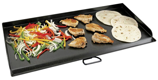 A plate of food on a white background, freshly cooked on the Camp Chef Griddles 16 for that perfect sear and flavor.