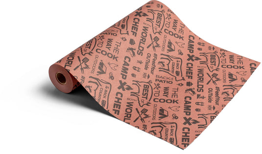 A roll of Camp Chef Pink Butcher Paper featuring black graphics and slogans like “Best Patio Cook” and “World’s Best,” plus grill-themed images—perfect for serving smoked meat at your next BBQ.