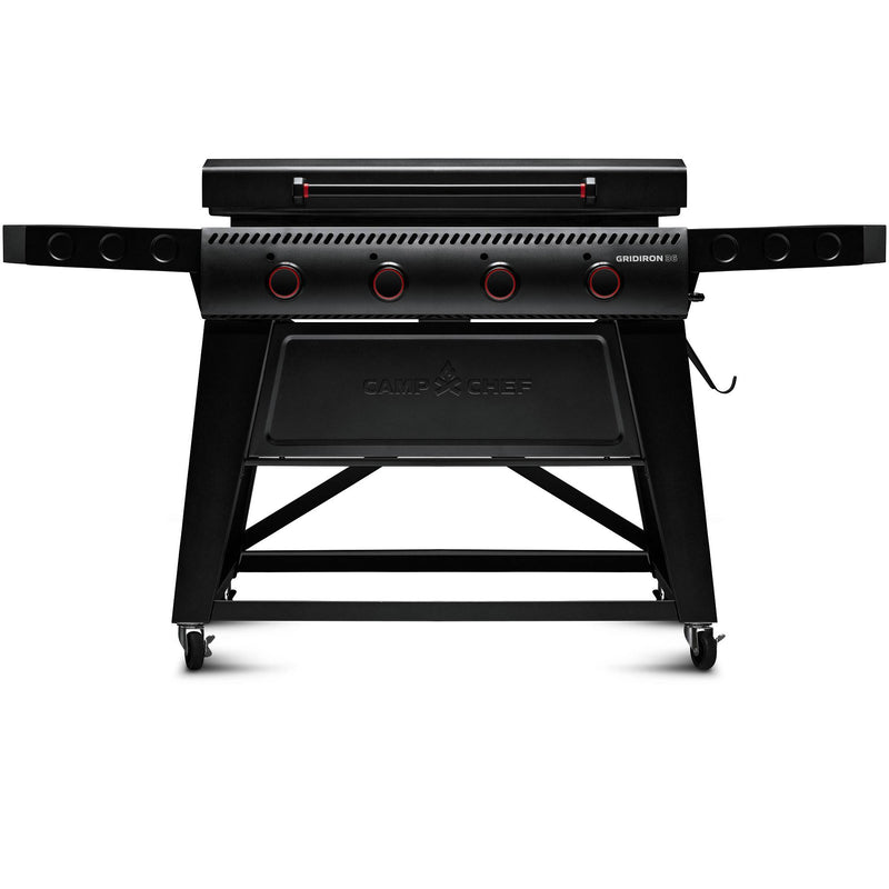 Load image into Gallery viewer, The Camp Chef Gridiron 36 is a black outdoor gas grill featuring four control knobs, foldable side shelves, a closed lid, and wheels for mobility, providing even heating and easy clean-up.
