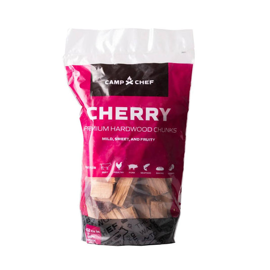 Camp Chef Wood Chunks offer mild, sweet, fruity flavors—perfect for your hardwood grill. Ideal for smoking meat, poultry, pork, seafood, baking, or vegetables. Clear packaging shows the chunks inside.