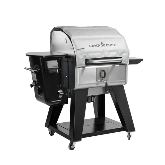 The Camp Chef Woodwind grill and smoker features stainless steel, wheels, a digital control panel, side shelf, and lower storage—compatible with the Camp Chef Woodwind Pro Blanket for fire-resistant protection.