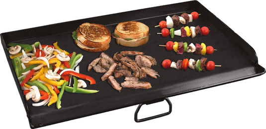 The Camp Chef Griddles 14 black Flat Top Griddle displays sliced bell peppers, onions, and mushrooms on the left, grilled sandwiches in the center, with cooked meat and three vibrant veggie and meat skewers on the right.