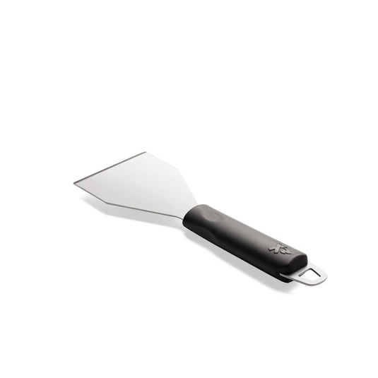 The Camp Chef Griddle Scraper features a wide, flat metal blade and black handle with a hanging loop, ideal for cleaning your flat top grill. Shown on a white background.