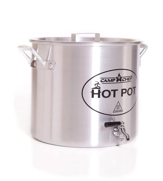 The Camp Chef Hot Water Pot is a large stainless steel pot with lid, side handles, and bottom spigot—ideal as an outdoor beverage dispenser for campsite hot drinks. "Camp Chef" branding is displayed on the front.