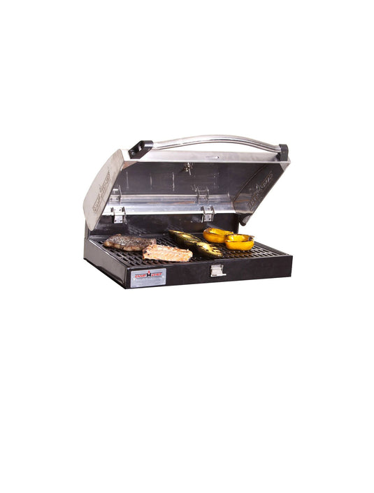 The Camp Chef BBQ Grill Boxes 16 is a stainless steel tabletop barbecue with an open lid and cast iron grates, grilling meat and vegetables to perfection.