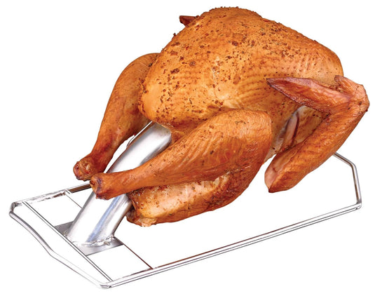 A whole turkey roasted upright on the Camp Chef Turkey Cannon Infusion Roaster stays moist and flavorful, ready to serve.