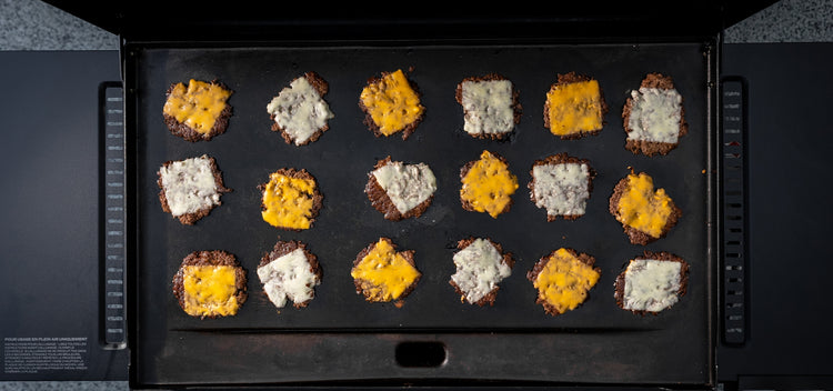 A tray of food on a black surface.
