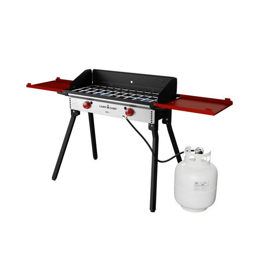 The Camp Chef PRO 14 is a portable outdoor gas grill with two red side shelves, two control knobs, black sturdy legs, and a white propane tank—ideal for outdoor cooking and part of the Camp Chef PRO 14 system.