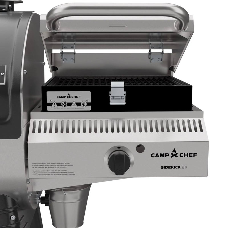Load image into Gallery viewer, A Camp Chef Sidekick stainless steel gas grill with an open lid, black grill box, and control knob—perfect for pairing with the Camp Chef Woodwind 24 pellet grill featuring a WIFI controller.
