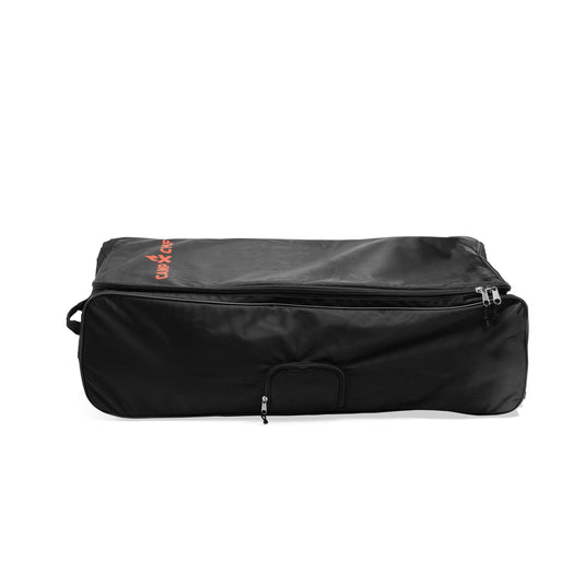 The Camp Chef Stove System Roller Bag is a large, rectangular black heavy-duty carry bag with a front handle and orange text in the top left corner. It features a partially open zipper and is shown lying flat on a white background.