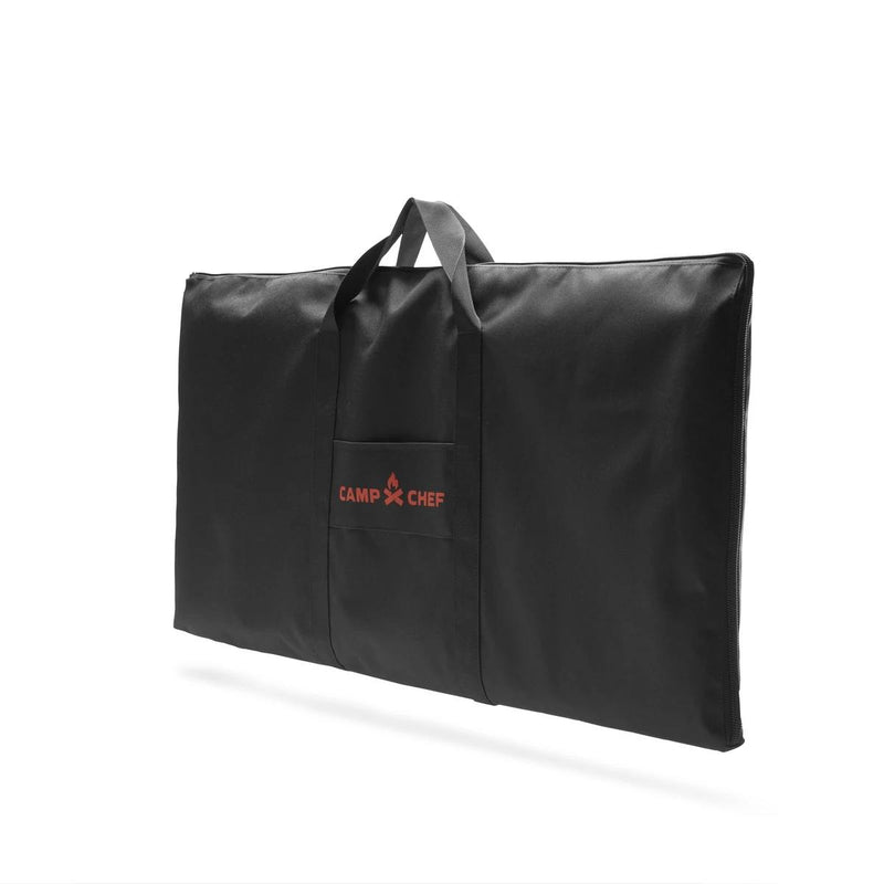 Load image into Gallery viewer, The Camp Chef Griddle Bag 14 - 2 Burner is a large black rectangular bag with handles, a front pocket featuring the red Camp Chef logo, an EZ glide zipper, and a weather-resistant liner. Shown against a white background.
