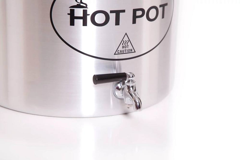 Load image into Gallery viewer, Close-up of the Camp Chef Hot Water Pot, a stainless steel outdoor dispenser with a black-handled spigot and labeled "Hot Water Pot." A caution symbol warns contents may be hot—perfect for campsite drinks. Its polished surface gleams.
