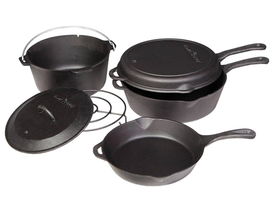 The Camp Chef 6-Piece Cast Iron Set includes two handled skillets, a handled Dutch oven, a lid, and a round trivet—all crafted from seasoned cast iron and shown on a white background.