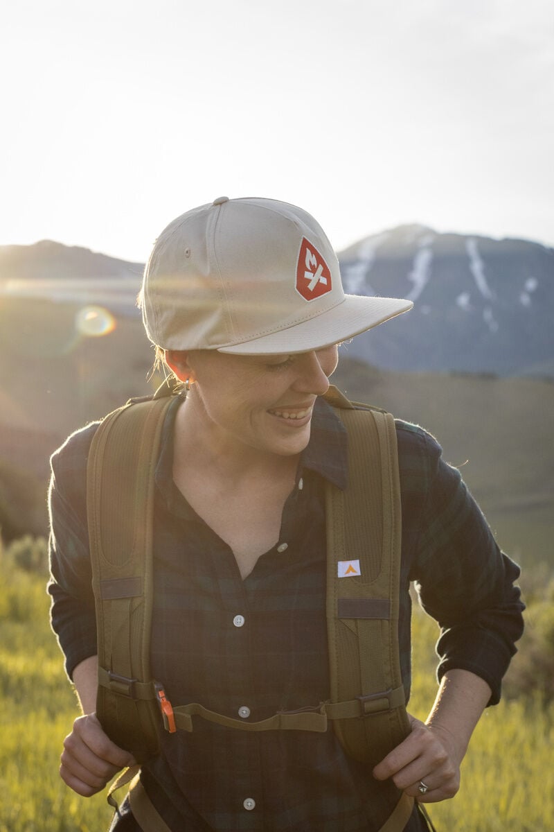 Woman hiking in Khaki Hat