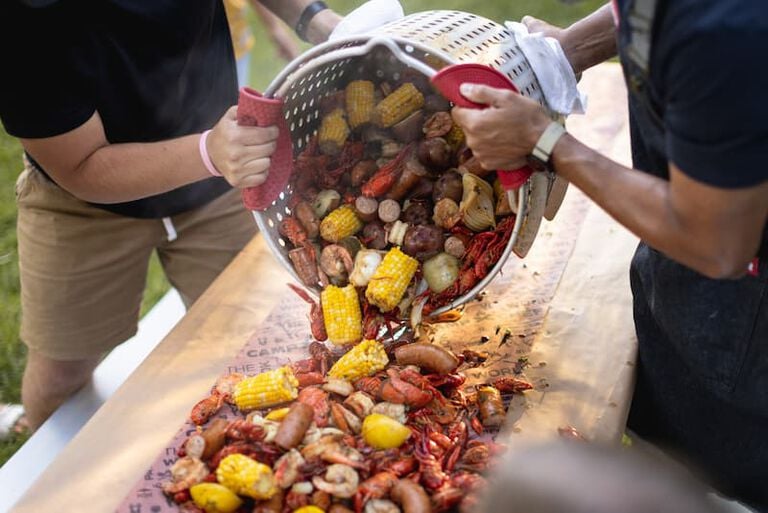 dumping on crawdad boil ingredients 