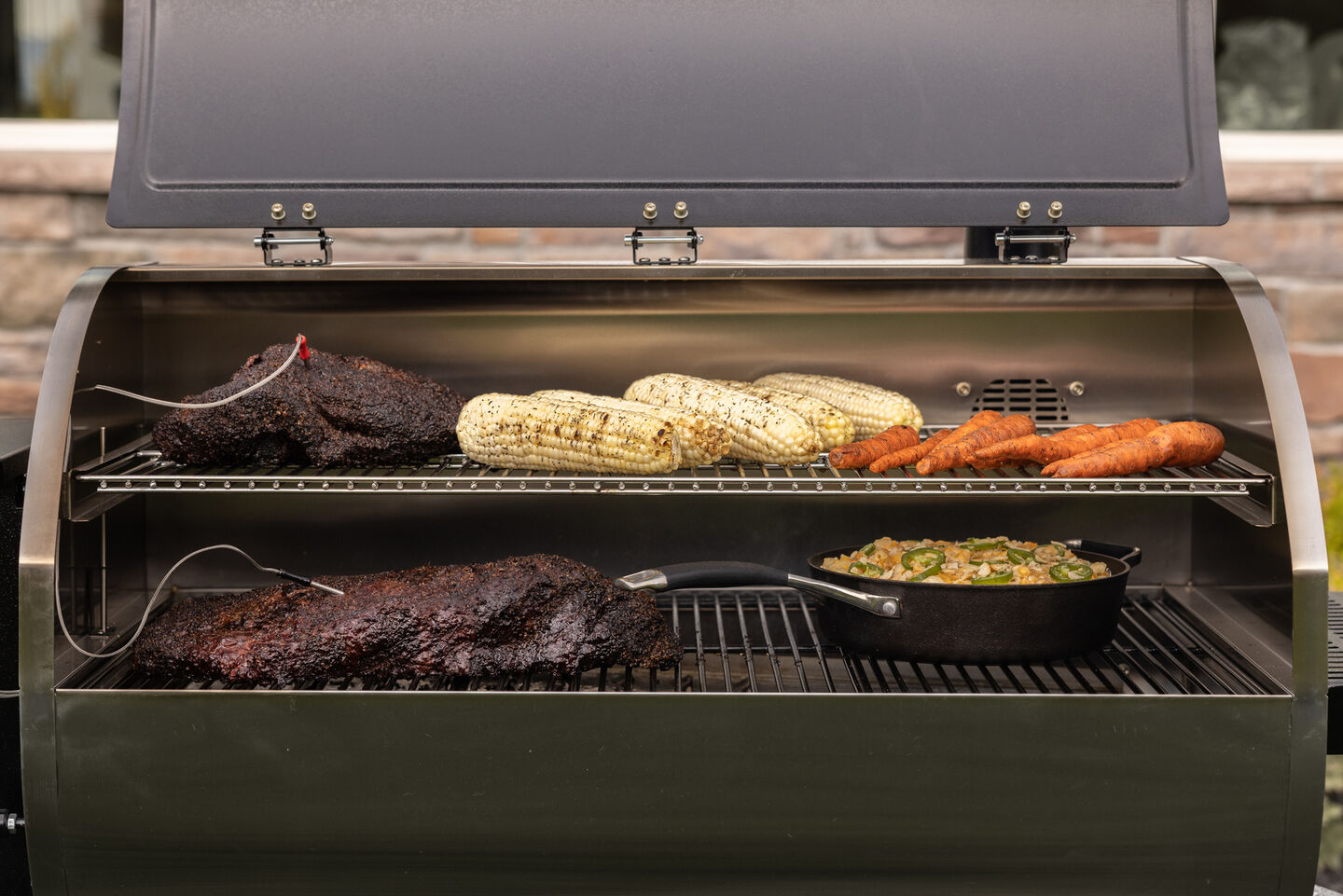 grill cooking all the food for a BBQ charcuterie board grill cooking all the food for a BBQ charcuterie board
