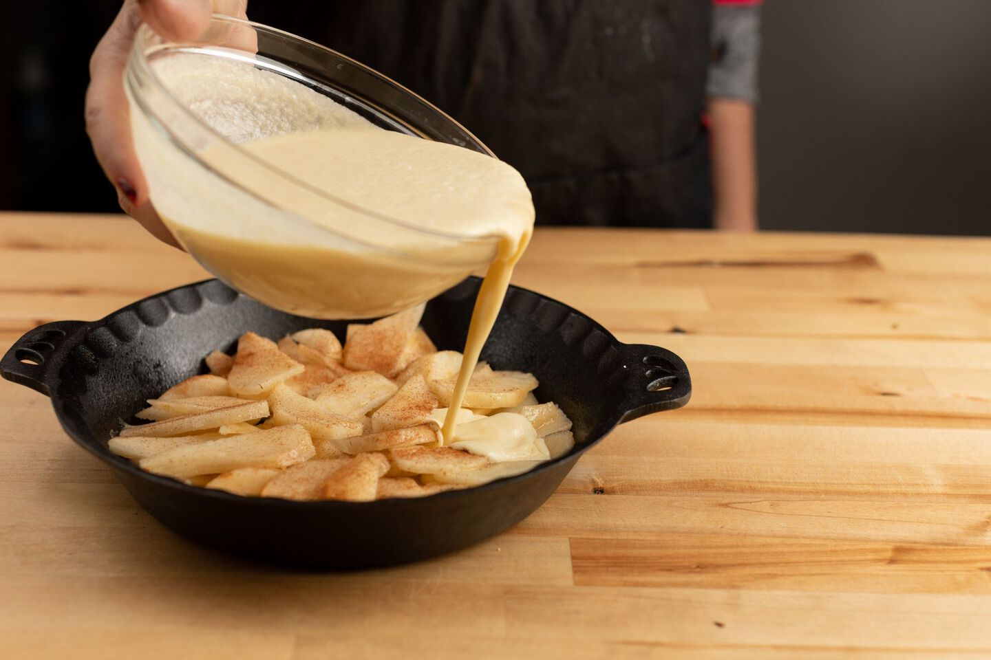 pouring batter in pan pouring batter in pan