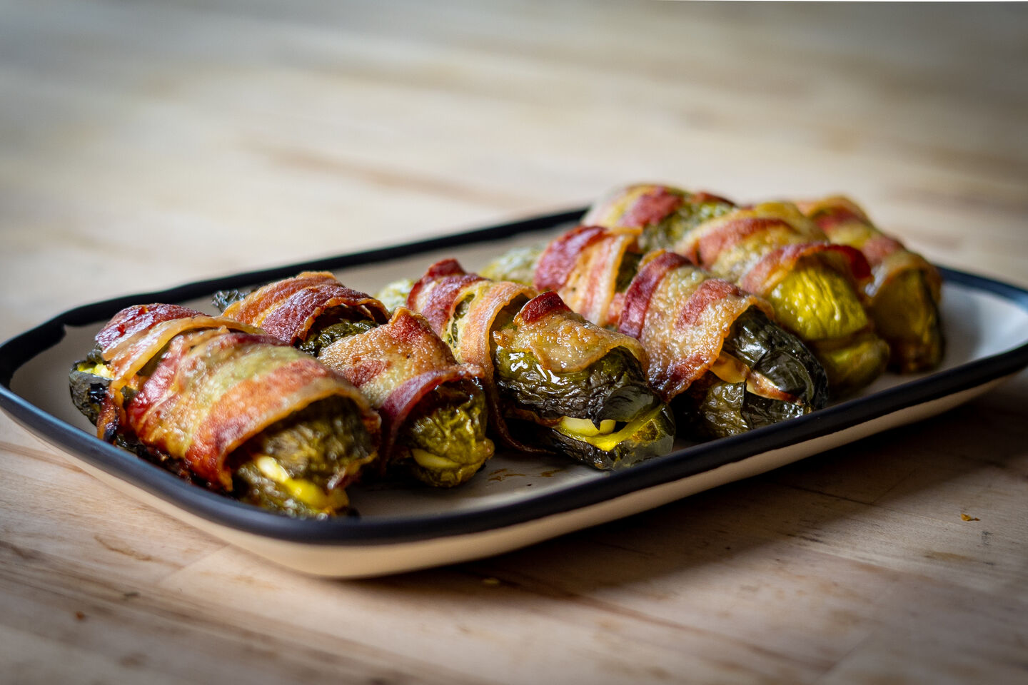 bacon wrapped stuffed pickle poppers
