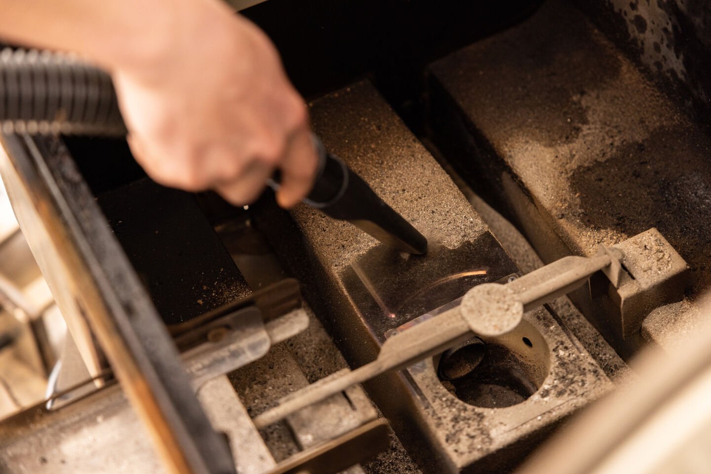 vacuuming out the bottom of a pellet grill vacuuming out the bottom of a pellet grill